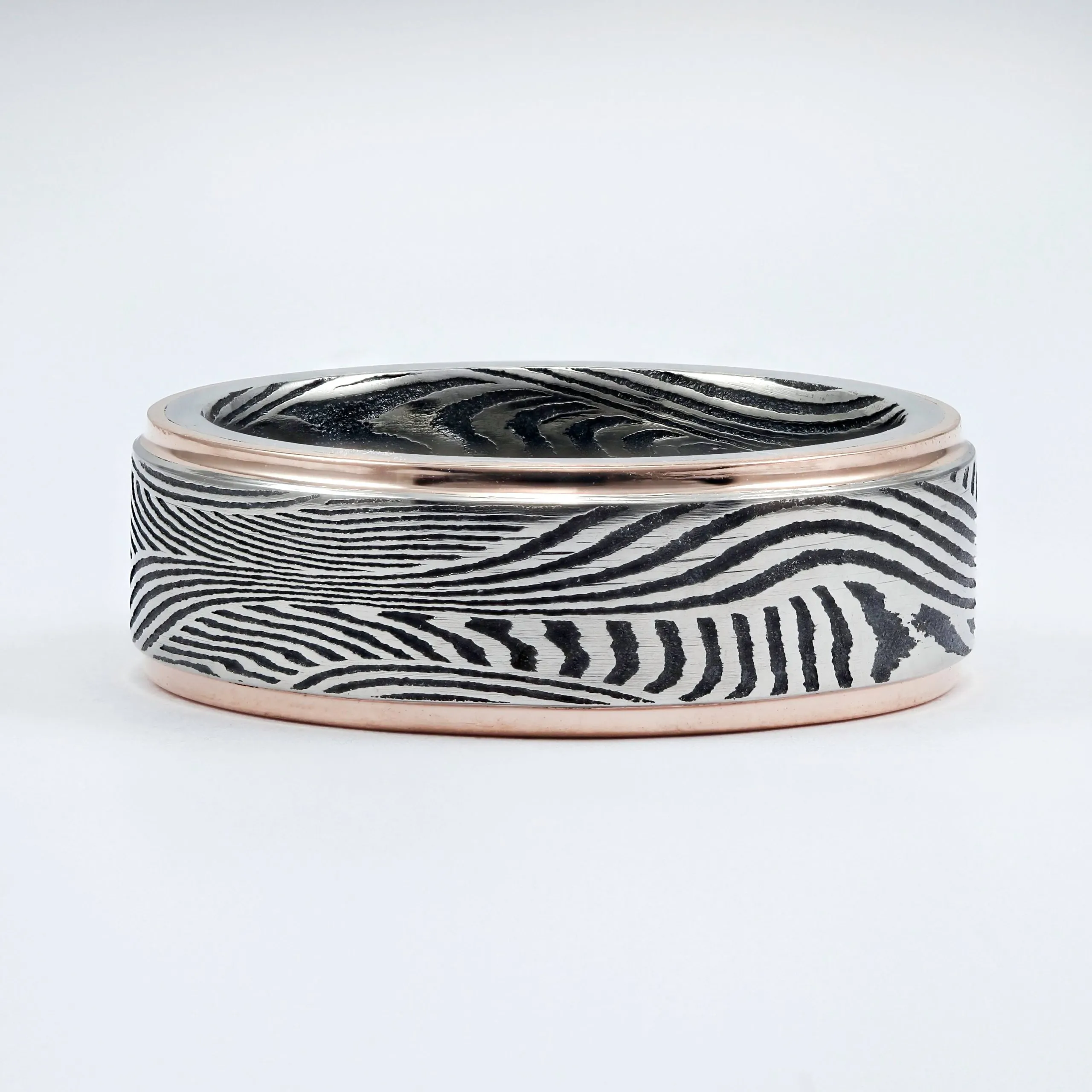 ACID FINISH SUNSET DAMASCUS STEEL WEDDING BAND WITH 14K ROSE GOLD EDGES